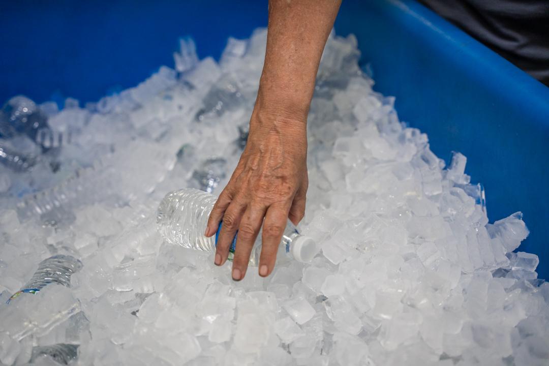 Hand grabbing water