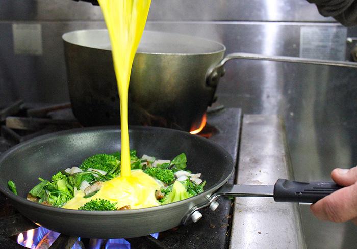 Chef Chris cooks a frittata in SVdP's kitchen.