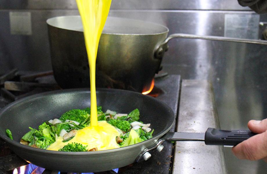 Chef Chris cooks a frittata in SVdP's kitchen.