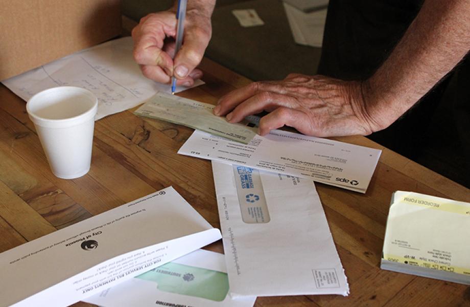 A Vincentian volunteer fills out paperwork to help a family in need.