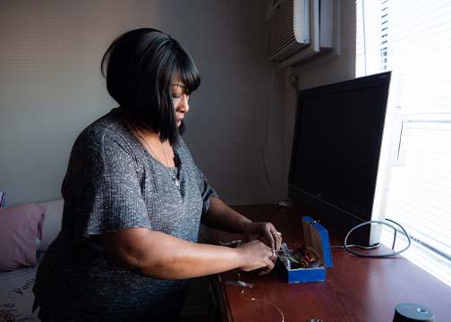 Woman taking things out of a small box