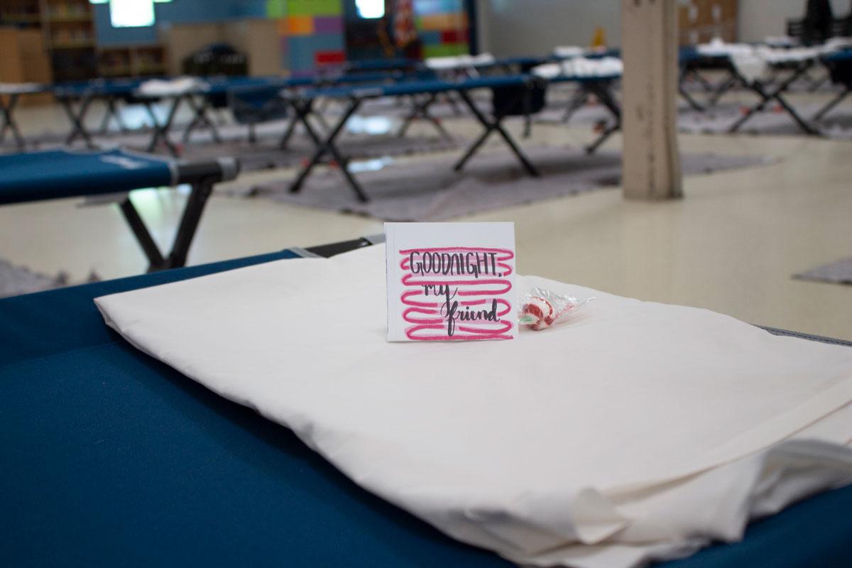 Card on the pillow of a cot