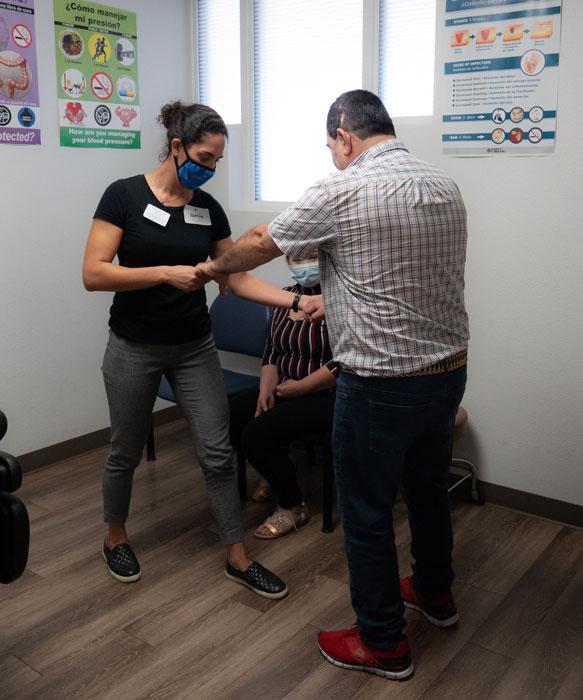 Dr. Jamie Nesbit and Ernesto end his physical therapy session with dancing.