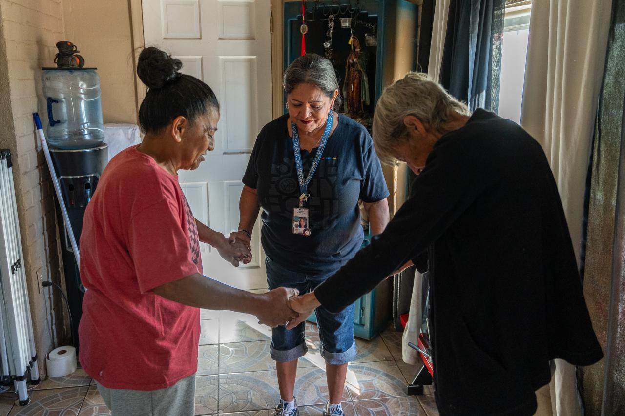 Elizabeth, Anne, and Margarita pray together before they finish their home visit.