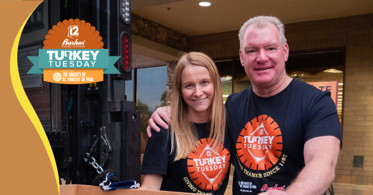 Turkey Tuesday volunteers stand at one of the turkey drop off locations.